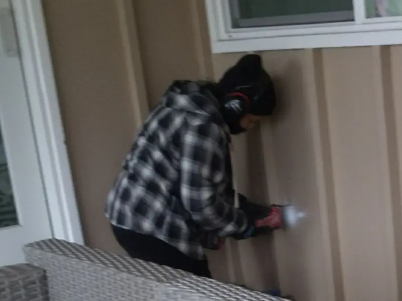 Professional electrician installing an exterior outlet in Willard