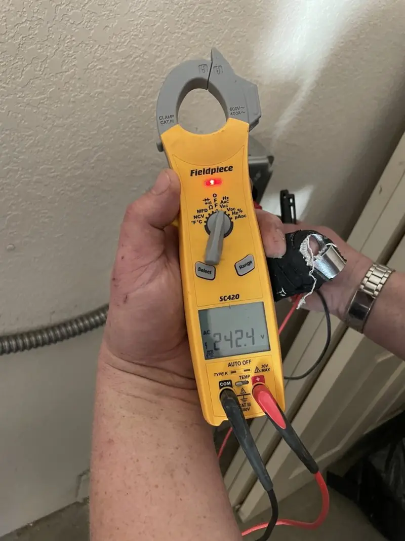 Voltage testing with clamp meter during Hot Tub / Pool Electrical Wiring in Willard